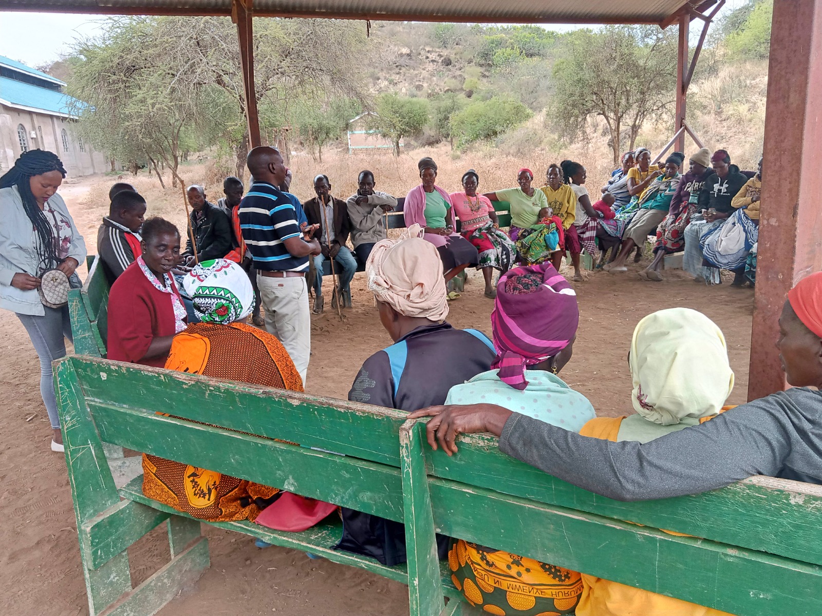 Community cooperative gathering under a shelter